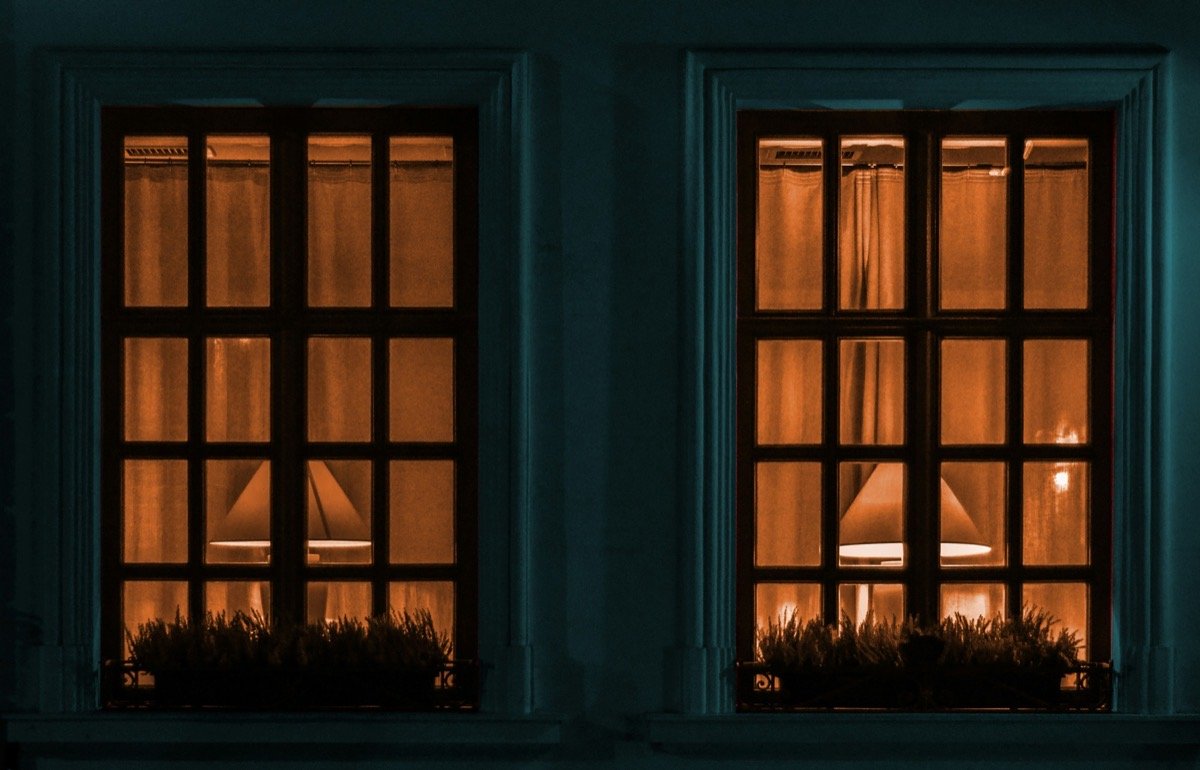 Evening light in the windows of a comfortable home